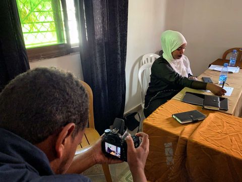 Filming an interview for a youth media project