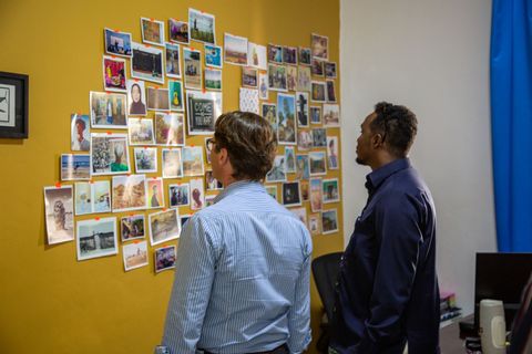 Partners looking at the photo wall