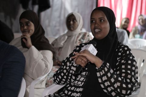 Audience member asking a question after a screening