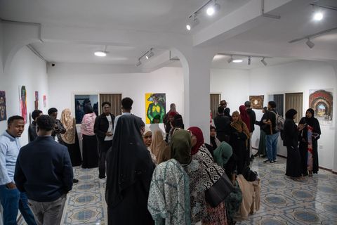 Visitors in the gallery at an opening
