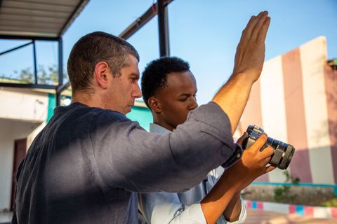 Trainer showing a participant how to frame a shot
