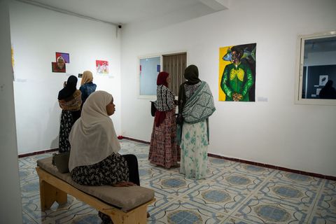Visitors in the gallery at Heer iyo Hiyikac