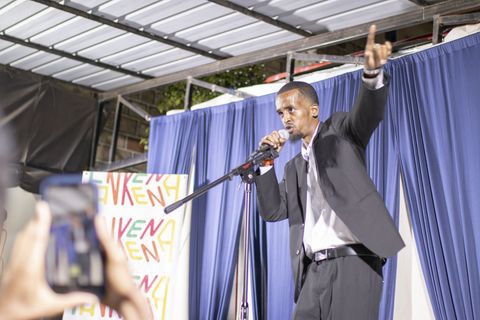 Performer on stage at a creative meet-up