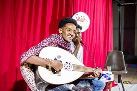 Musician recording with the oud