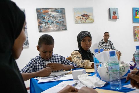 Children drawing in the workspace