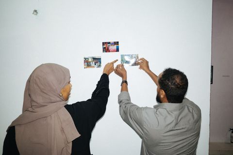 Participants arranging photos for a photo story