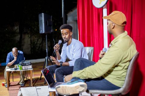 Guest speaking into the microphone