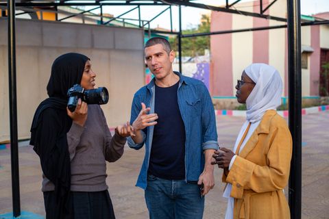 Photography trainer with two participants