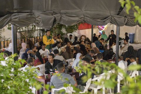 Audience in the courtyard under the roof
