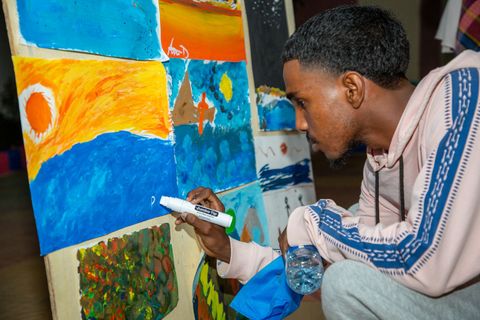 Participant adding to a painted wall