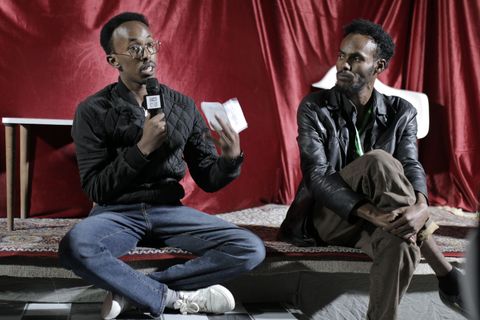 Filmmaker talk on the red-curtain stage