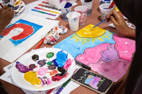 Paint palette and artwork in the ateliers