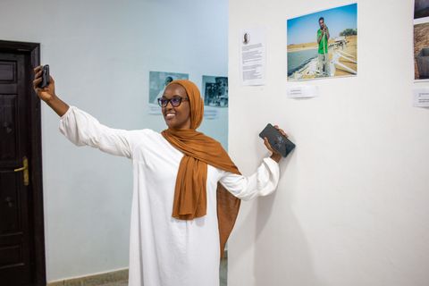 Visitor taking a selfie at the AFAC photo exhibition