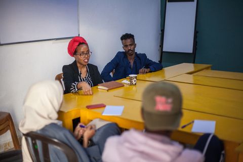 Workshop around the tables in the workspace