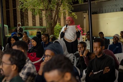 Audience during a screening in the courtyard