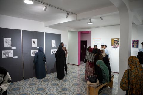 Visitors in the gallery at Heer iyo Hiyikac