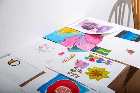 Drawings and paints on a table after a workshop